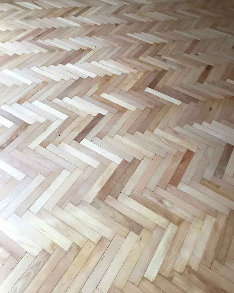 Image shows wooden parquet flooring having been sanded using dust-free machinery by Mark Antony & Sons in Tunbridge Wells, Kent.